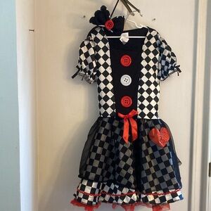 Girls size 10-12 checkered costume with bow head piece. Marionette/queen hearts